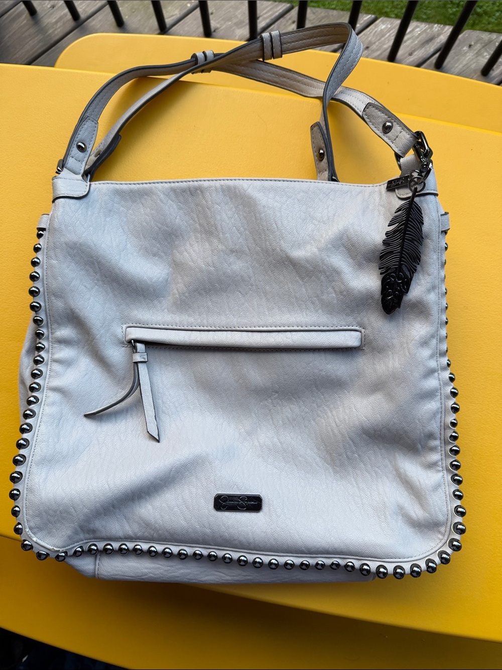 Jessica Simpson Light Gray Stud-Trim Shoulder Bag with Feather Charm
